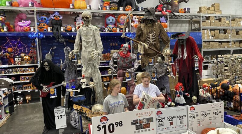 People look at Halloween displays at a Lowe's Home Improvement store in East Rutherford, NJ, on August 30, 2023.