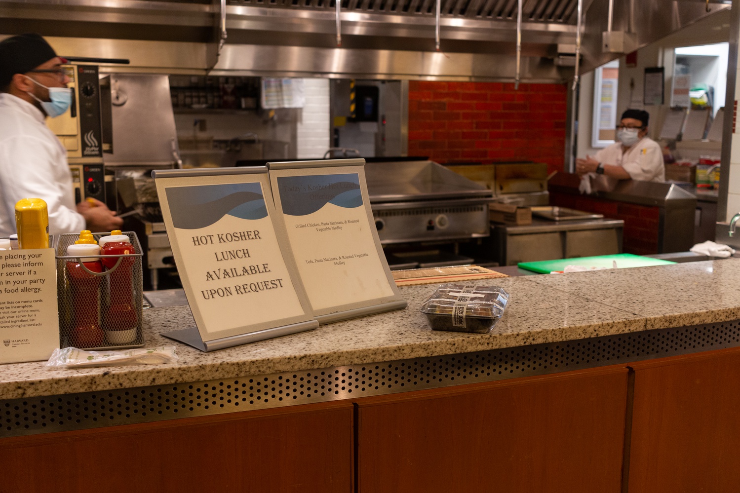 The sign is promoting a kosher hot lunch pilot program in the Quincy House dining hall, which began in the fall of 2021.